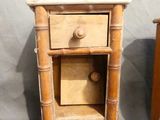 a small wooden table with a drawer on top of it