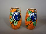 two vases that are painted with blue flowers on them