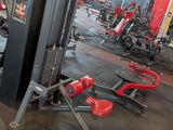a gym with a lot of machines in the room