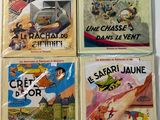 four children ' s books are lined up on a white surface