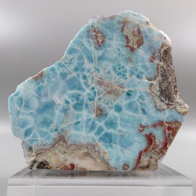 a picture of a piece of blue and white marble on a clear base