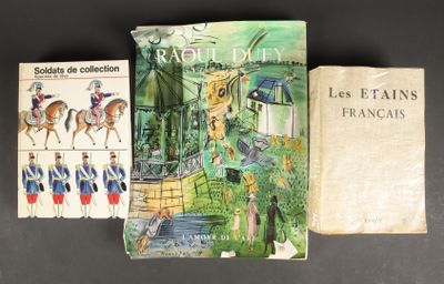 three books are sitting on a table next to each other