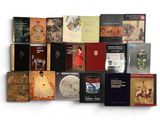 a lot of books that are sitting on a table