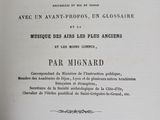 an old book with a black and white image of a bottle of wine