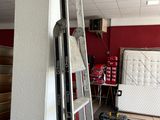 a ladder leaning up against a wall in a room