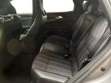 the back seats of a car are black and grey in color