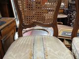 two chairs that are sitting next to each other in a room
