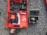 a red box with tools on the ground next to it
