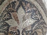 a close up of a vase with a design on it