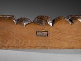 three birds sitting on top of a wooden box