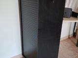 an image of a black refrigerator in a room