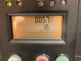 a close up of a parking meter with a clock on it