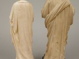 two figurines of jesus and a woman standing next to each other