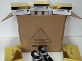 the box is full of black and white shoes and a pair of black shoes