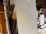 an image of a room with a white board on the floor