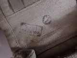 a close up of a bag with a cat inside of it