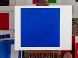 a picture of a painting on a easel in a room
