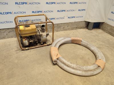 a machine that is sitting on the floor next to a hose