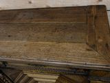 a wooden table with a drawer on top of it