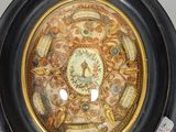a picture of a decorative plate with a clock on it