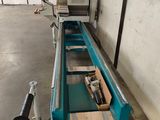 an image of a conveyor belt in a warehouse
