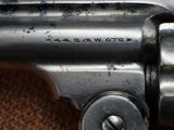 an old gun that is sitting on top of a brown carpet