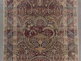 tapis persan ancien à motif floral sur fond bleu