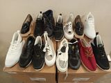 many pairs of shoes that are sitting on top of a box