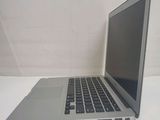 a laptop computer sitting on a table with a white background