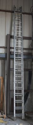 many ladders that are sitting in a building