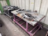 many tools sitting on a table in a garage