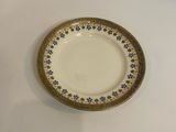 a plate with a flower pattern on it on a table