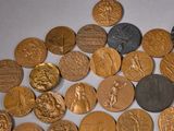 a lot of coins that are sitting on a table