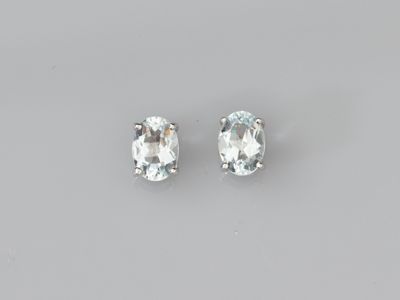 an image of a pair of white topazte earrings