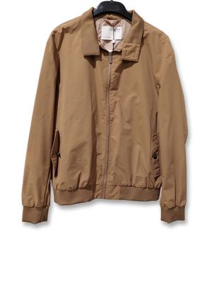 an image of a jacket hanging on a hanger on a wall