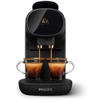 a black coffee machine with two cups of coffee in front of it