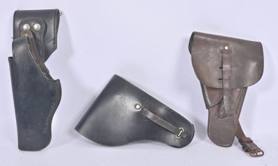 three different types of leather holsters are shown on a white background