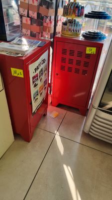 two refrigerators that are sitting next to each other in a store