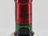 a bottle of wine that is sitting on a table
