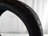 a tire that is sitting on a white surface