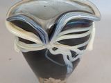 a black and white vase sitting on a table