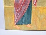 painting of a woman holding a cross in her right hand