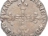 une vieille pièce d'argent ornée d'une croix