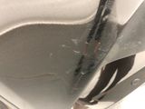 a close up of a car door handle with a sticker on it