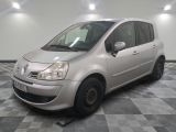 a picture of a small silver car parked in a garage