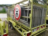 a yellow truck with a sign on the back of it