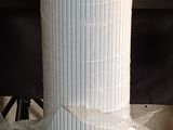 a stack of rolls of toilet paper sitting on the floor