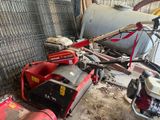 a small machine that is sitting in a garage