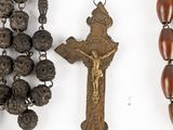 a rosary and a crucift hanging from a chain