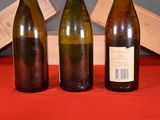 three bottles of wine sitting next to each other on a table